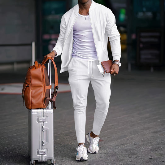 Stylish White Tracksuit With Brown Leather Backpack And Silver Rolling Luggage
